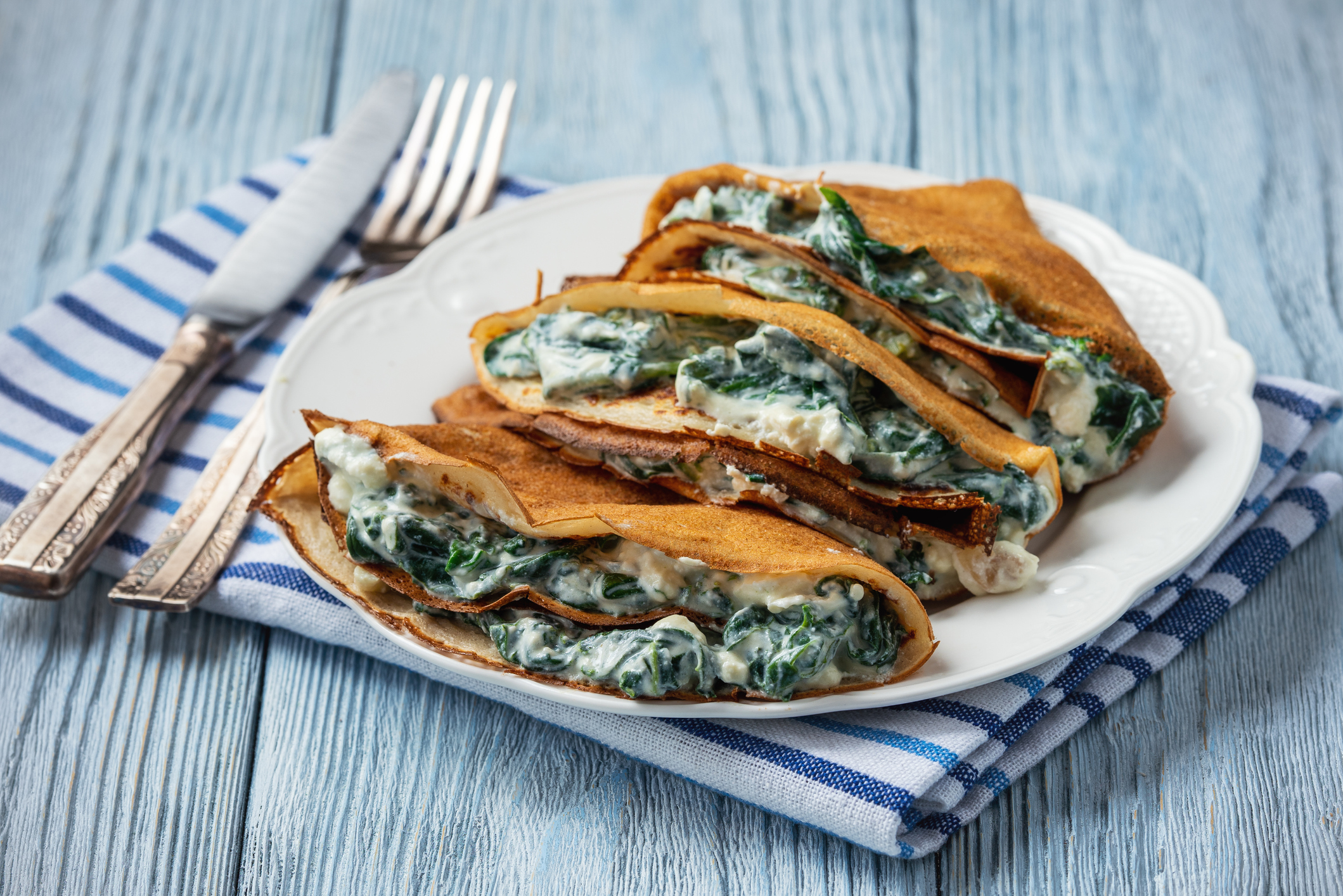 Spinach and feta cheese filled crepes.
